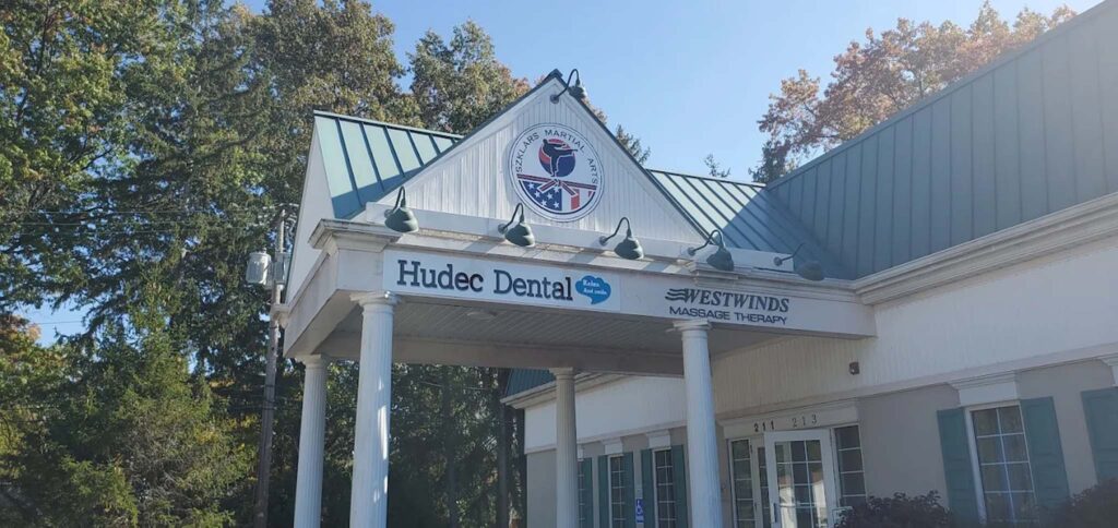 Amherst Hudec Dental - overhand in front of front door with logo