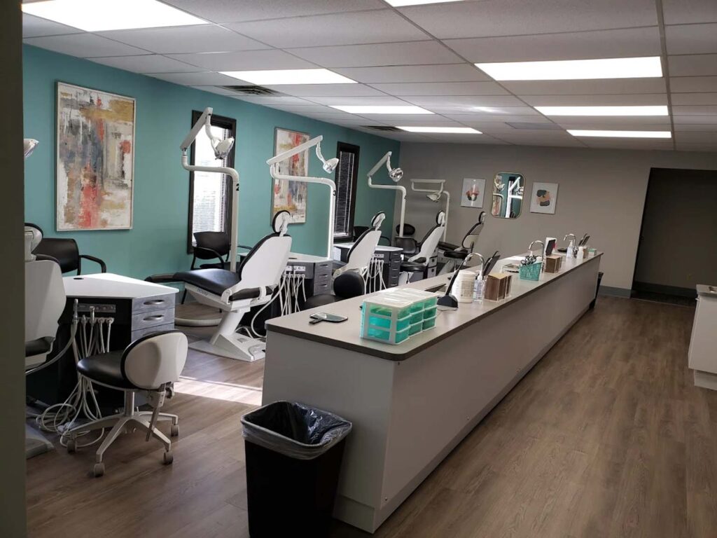 Dental office with chairs, tools, and sinks