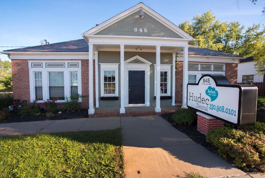 Hudec Dental in Macedonia - building with brick and white pillars
