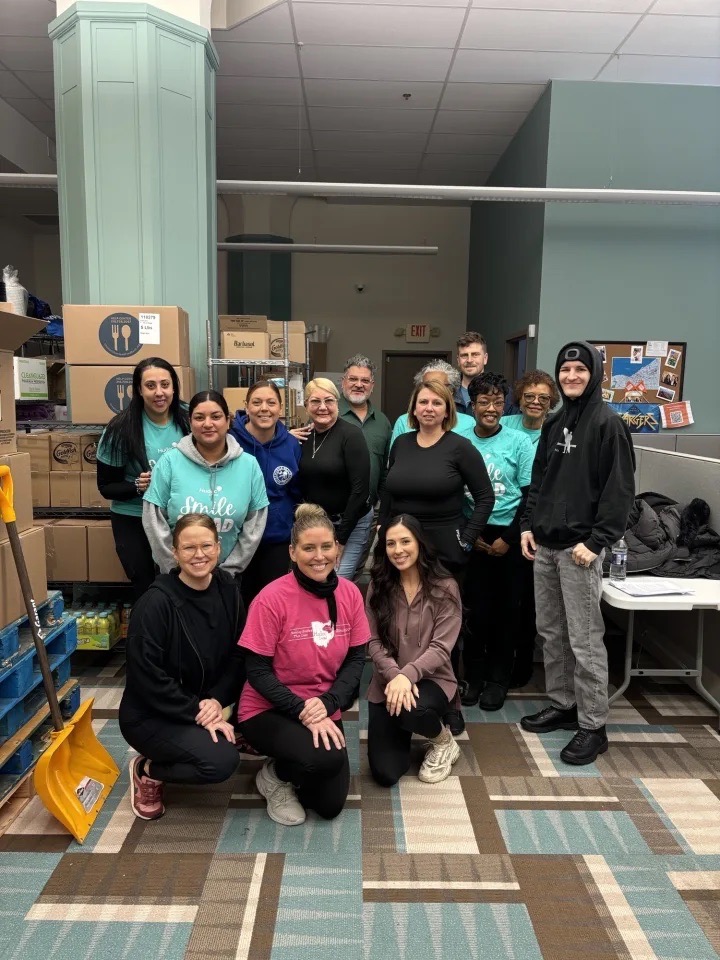 Group photo of Hudec Dental volunteers at the January Hunger project center
