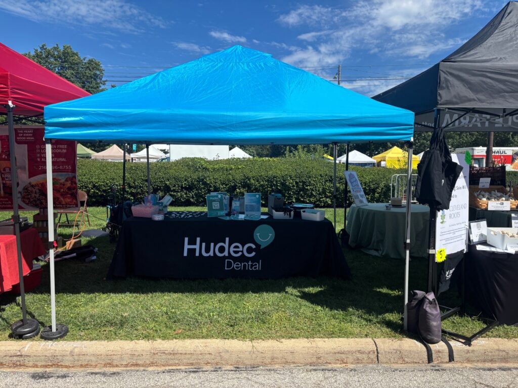 Wide view of the Hudec Dental table and tent at the 2026 Cleveland Garlic Festival